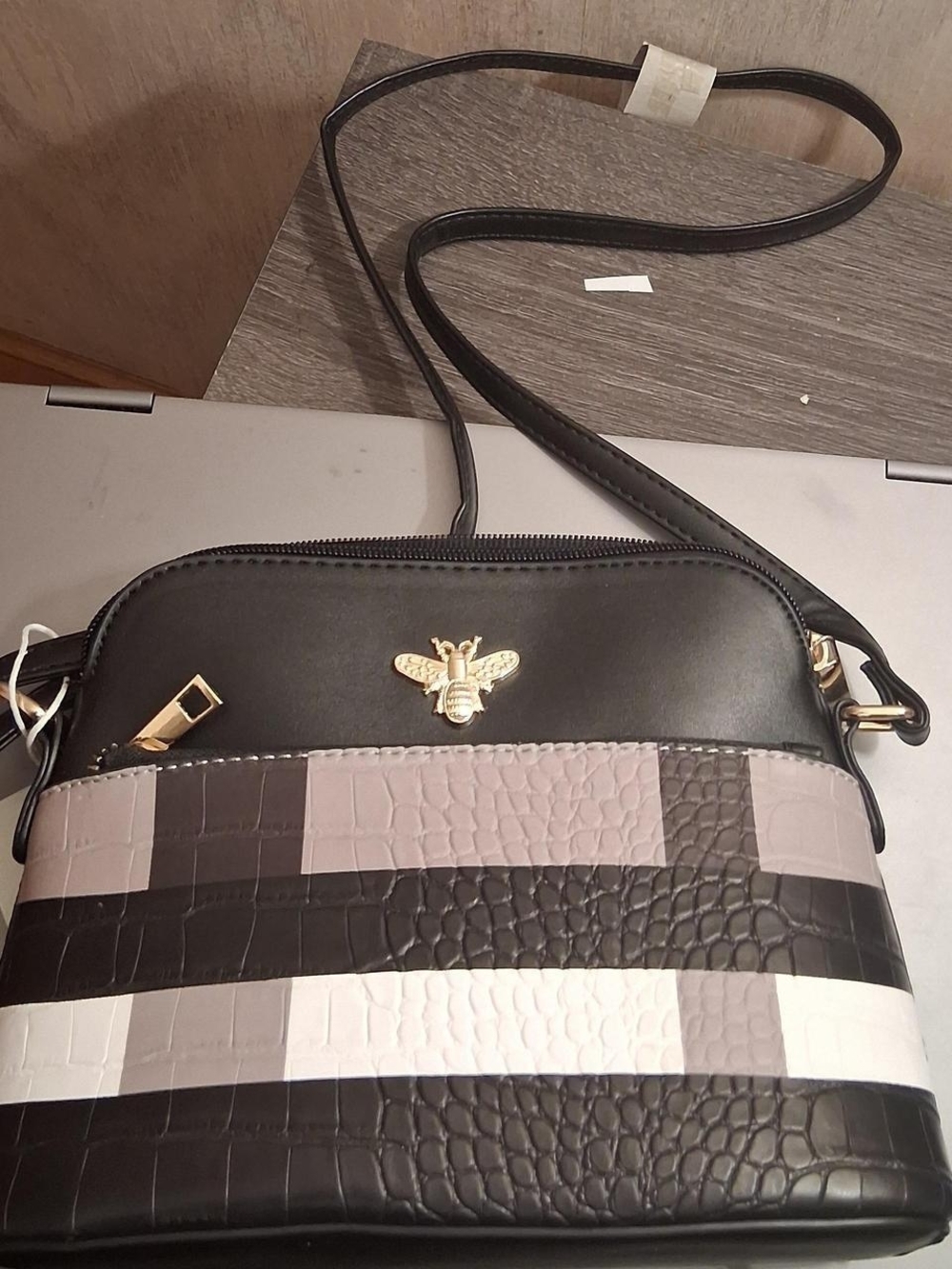 Structured Crossbody Bag in Black and Taupe with Gold Bee Accent